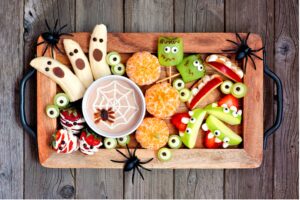 A tray of food with halloween candy spiders and candy monsters on it, A Sweet Alternative: Celebrating Halloween Without Sugar